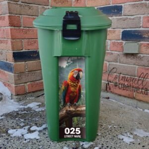 Vibrant parrot perched on a tree branch Green Bin Sticker